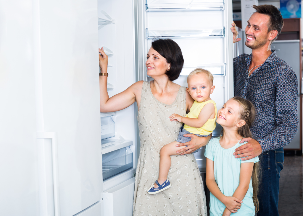 Family looking at a fridge